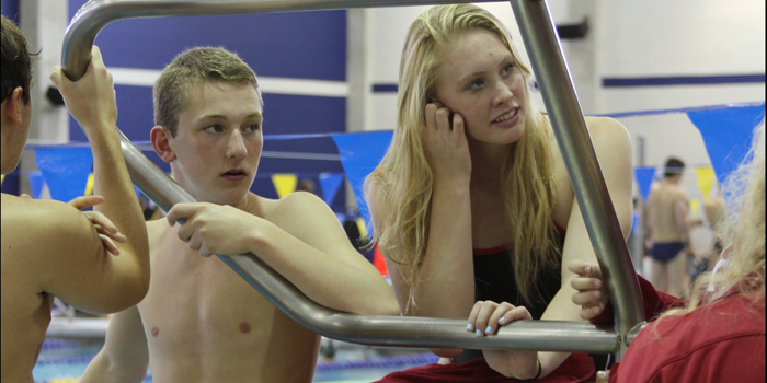 Sophomore Will Tullbane and junior Madison Yelle talk before their races at the Duncanville Invite on Sep. 6.