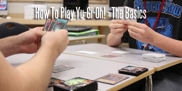 Seniors Jesse Wright and Zachary McCartney play a match of Yu-Gi-Oh! after school.