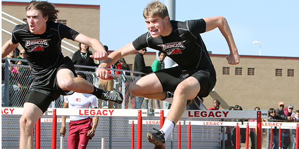 Sophomore Garrett Moore and Junior Kyle Dragulski race the 110 meter hurdles at Legacys annual track meet.