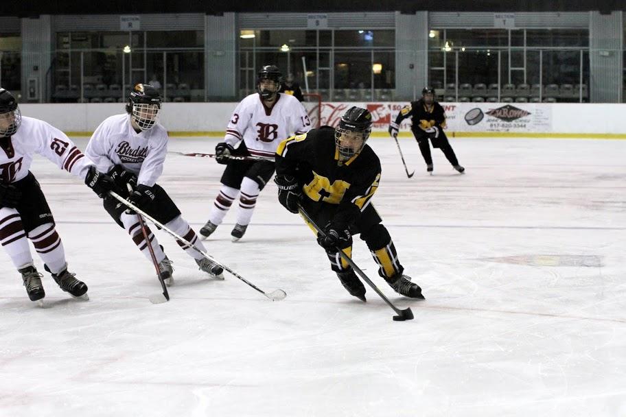 Mansfield player positions the puck for a shot.