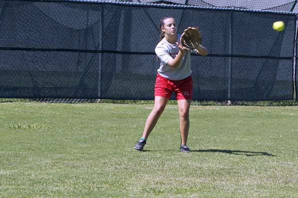 Sara Scott, 12, works on her throw during practice.