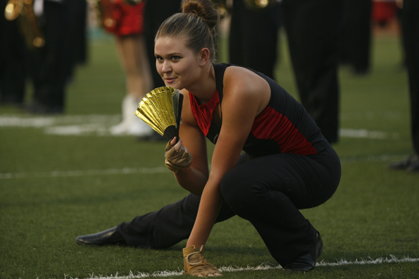 Taylor Green, 11, performs at the homecoming game.
