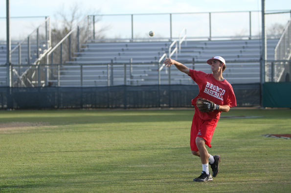 Sam Mahofski, 12, warms up his throw before practice.