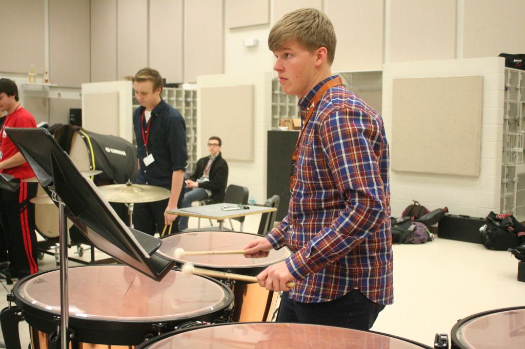 Senior+Mason+Baas+practicing+for+the+upcoming+percussion+ensemble+concert+in+May.
