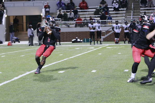 Terrance Ivery, 12, makes a pass during Legacys football game against Lake Ridge. 