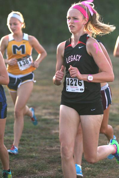 Amelia Jackson, 11, wears pink for breast cancer awareness, a Legacy tradition at the Mansfield Invitational Meet. (Jada Succes Photo)