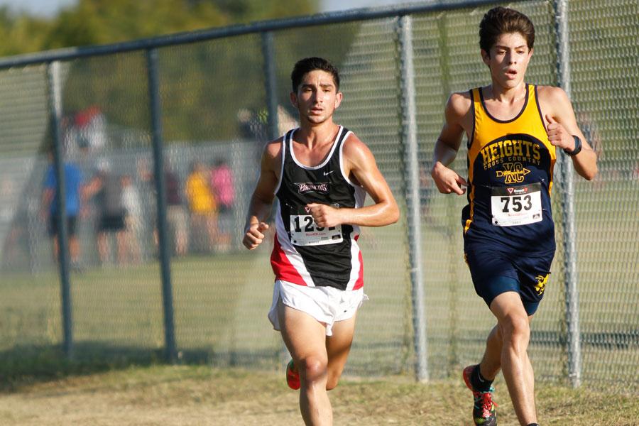 Jake Weith, 12, competes in the 5A/6A Varsity race at the Mansfield Invitational meet. Weith placed fourth overall.