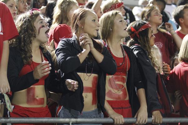 Nicole Moldenhauer, 11, Ashley Richardson, 12, and Reagan Wright, 12, show their spirit at the annual Red Out game.