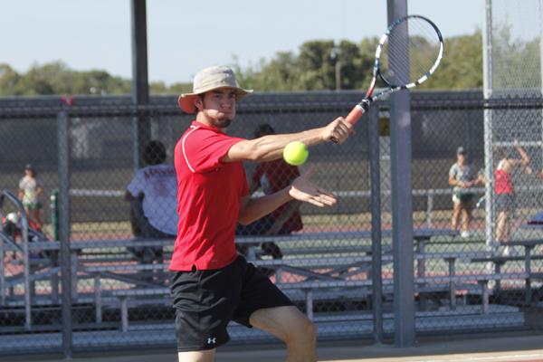 Senior, Luca Chudoba competes in  a tennis match against Lake Ridge.  