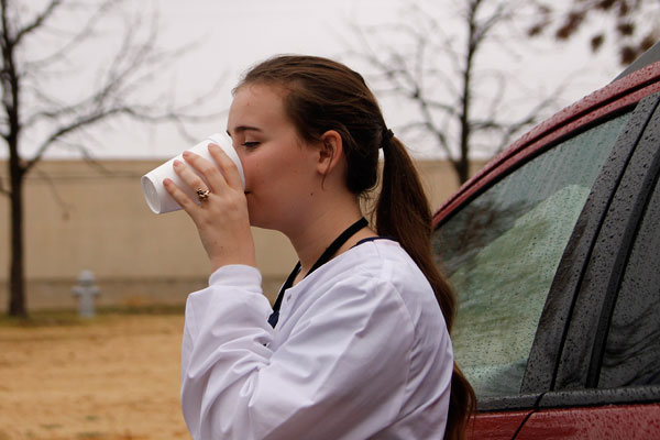 Heather Hines,12, drinks coffee outside of school from a local gas station. (Sterling Greback Photo)