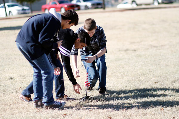 Davis physics class launches rockets behind the school for a force experiment.

