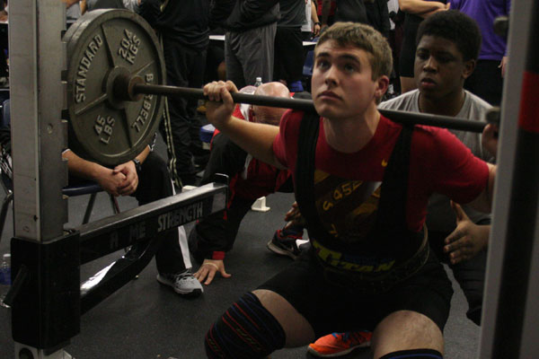 Tyler Straun, 11, preparing for his event at the powerlifting meet.