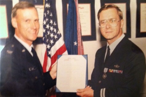 Dr. Stephan Shardy poses with his Wing Commander to accept an Air Force Commendation Medal.
