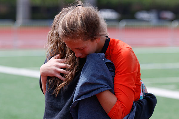 Goalkeeper Kyleigh Hall, 10, embraces Kaylee Wilkinson, 10, after the teams 3-0 loss to Wylie East High School.