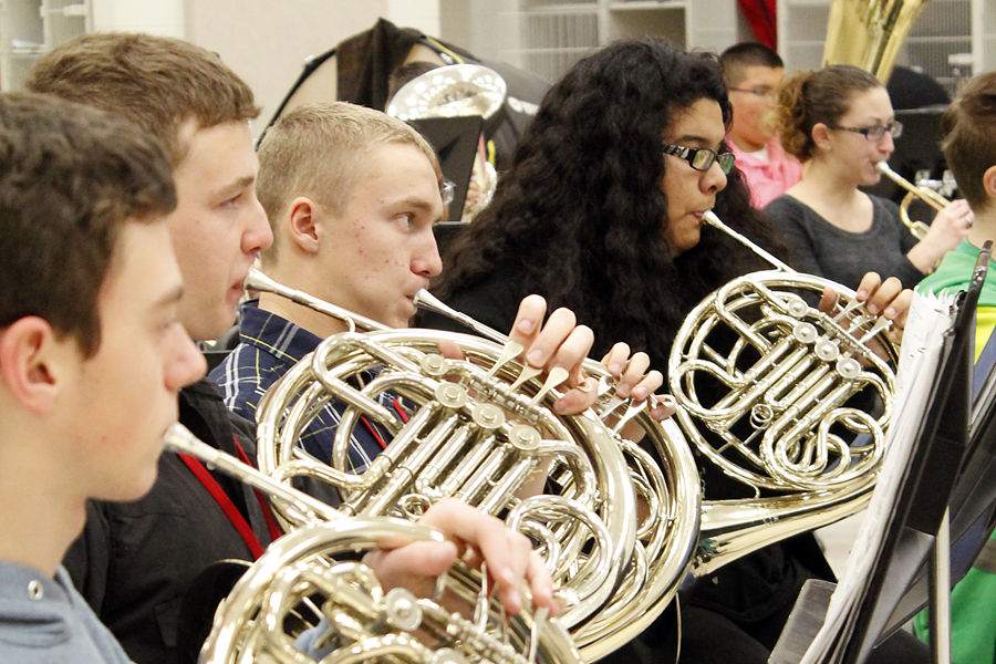 Band students rehearse for a winter concert before their fourth-annual golf tournament.