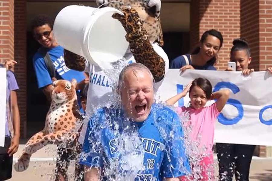 Dr.+Jim+Vaszauskas+has+cold+water+poured+on+him+at+Mansfield+Summit+High+School+for+the+ALS+Ice+Bucket+Challenge.