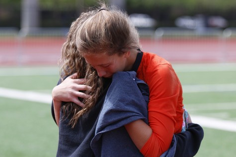 Goalkeeper Kyleigh Hall, 10, embraces a fan after the teams 3-0 loss to Wylie East High School.