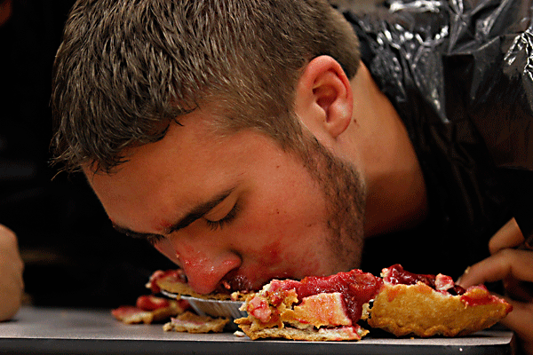 Tyler Strawn, 12, eats a cherry pie during the pie eating contest at the Senior pep rally on Nov. 6. (Maddy Brown photo)