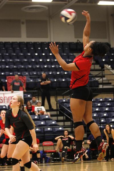 Talyn Moody, 12, spikes the ball to Summit at the varsity volleyball game on Friday Oct. 9. Varsity girls play today at 6:30 pm at Timberview High School. (Maddy Brown photo) 