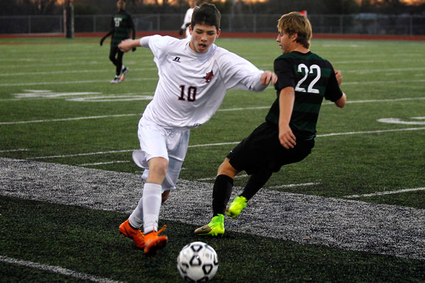 Mikey Keefer, 10, defends the ball from the Lake Ridge opponent on Feb. 9 at the JV Boys soccer game. (Mia Trahan photo)