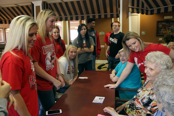 At the Walnut Creek Assisted Living Center, Brittnay Ballance, 12, Raegan Wright, 12, and Rachel Henry, 12, visit with seniors on Feb. 12 during the Teen II class. (Aisha DeBurr photo)