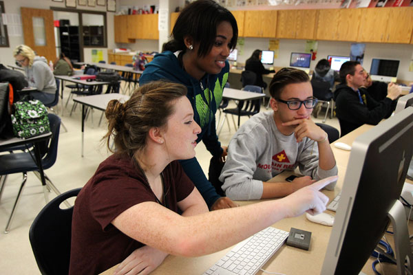 Yearbook Editor, Brooke Jackson, 12, works on a page with Index Editor, LeBrittany Smith, 12, and Assistant Yearbook Editor, Kyle Sims, 12, on Jan. 6 in the journalism room. The last day to purchase your yearbook is Thursday, Jan. 7. Visit therideronline.com to purchase one now! #ThingsThatCostMoreThanAYearbook (Aisha DeBurr photo)