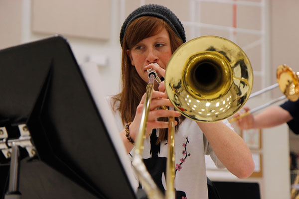 In the Band Hall, Nikki LaVoie, 12, warms up on her trombone in preparation for her Area audition on Saturday Jan. 9. (Maddy Brown photo)