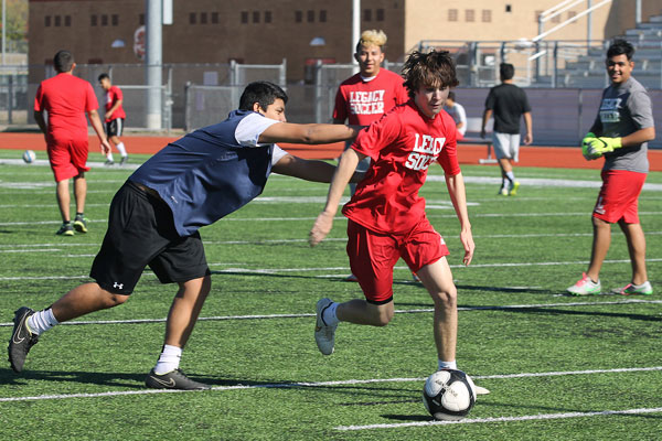 Barrett Wilson, 10, protects the ball from his opponent during soccer practice on Dec. 3. (Mia Trahan photo)