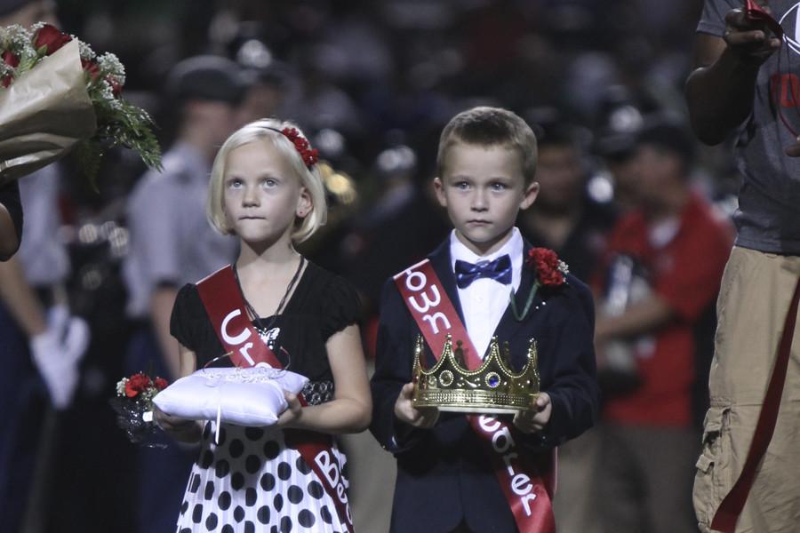 Reese Mallett and Lincoln Schroeder hold the homecoming crowns in 2013 during the halftime ceremony. The 2015 theme is FAMILY.