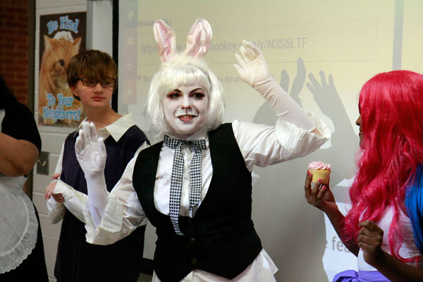 Anime club performs cosplay during meeting.