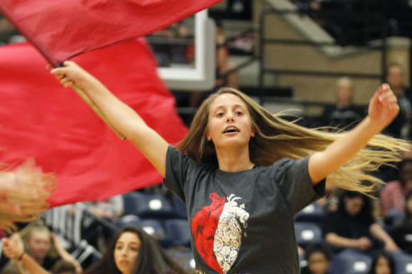Lea Cunningham, 10, performs with Color Guard during a pep rally. (Kassidy Duncan photo)
