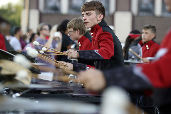 Sean Darby, 11, performs with band during a varsity football game. (Zane Hudson photo)