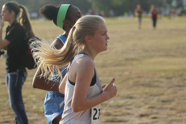Student competes in a cross country meet.