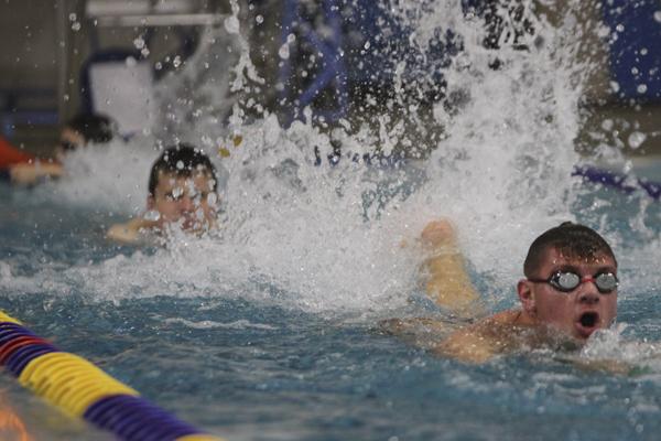 Junior Jacob Newsome swims laps during practice. 