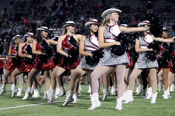 Captain Abby Walker leads the Silver Spurs in a performance during the football game against Wichita Falls.