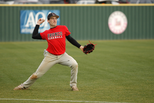 Nathan Rooney, 12, throws the baseball during a varsity baseball scrimmage. (Tori Greene photo)