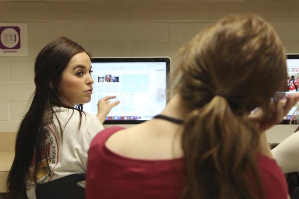 Shelby Warner works on a page for the 2016 yearbook with Brooke Jackson.