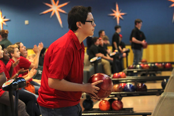 ___, __, prepares to bowl during a Legacy bowling match at Alley Cats. 