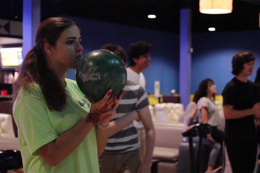 Emily Aller, 11, prepares to bowl at Alley Cats at a team practice.