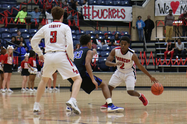 Trevone Fuller, 10, dribbles the ball during a district game against Seguin. 