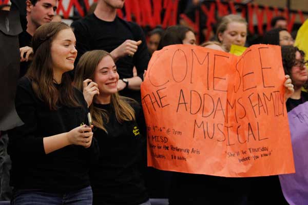 Sarah Haslam, 12, and Clara Griepp, 11, promote the opening of The Addams Family at the pep rally on Friday, Jan. 29. 