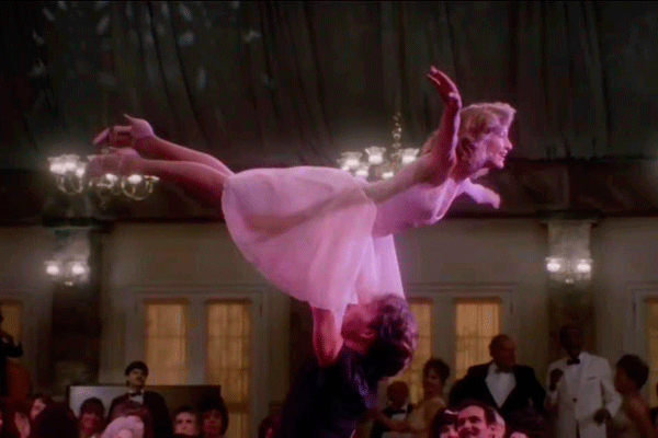 Johnny Castle lifts up Baby Houseman in their iconic dance scene from Dirty Dancing.