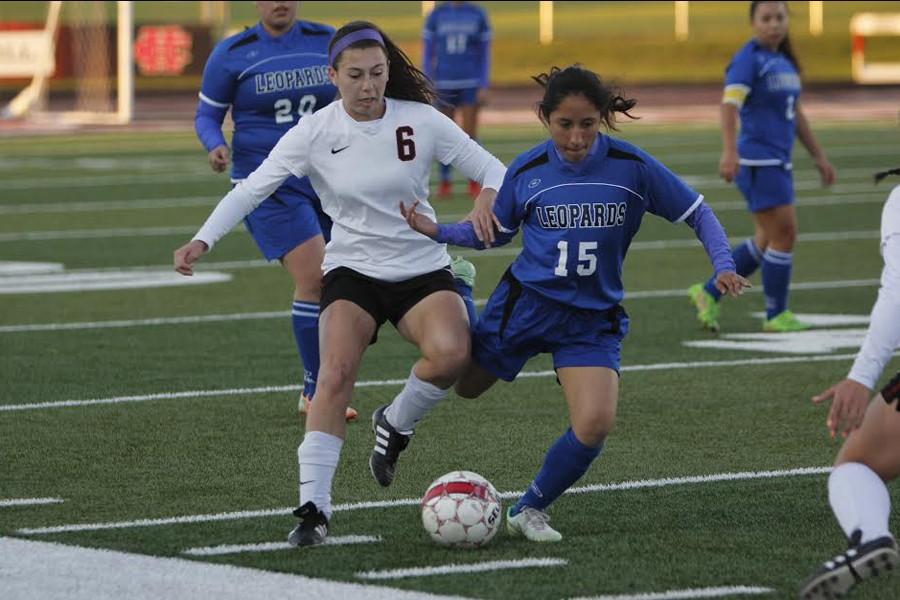 Jessica Devault, 11, steals the ball from the opposing player. The Broncos advance to the Area Playoff game.