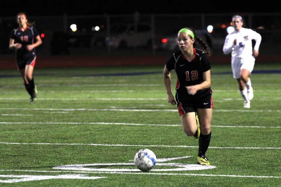 Hannah Daaboul, 11, kicks the soccer ball down the field. 