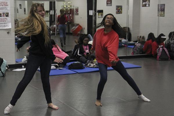 Maddison Kirby, (right), 10, dances in dance two class. 