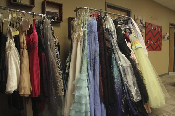 The attendance office has many prom dresses, purses, and shoes to borrow for girls to look at for prom. 