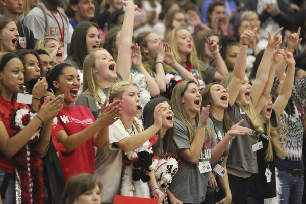 Students cheer in the stands at the homecoming pep rally last year in the varsity gym. 