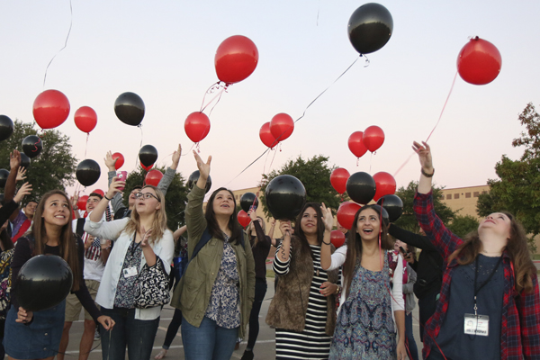 Seniors make a wish as they release their balloons at senior sunrise. (Jonathan Vo photo)
