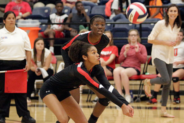 Keslyn King, 10, watches the volleyball as it comes down to hit her arms at the varsity game on Sept. 20.