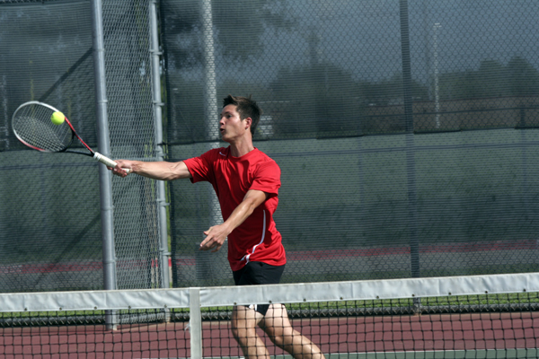 Ben Slavik, 12, returns the ball during a tennis match